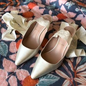 Kate Spade satin mules.